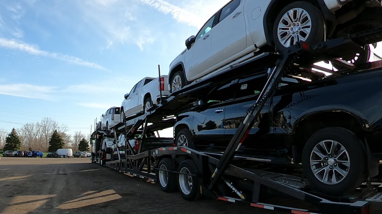 Multi-car carrier loaded with dealer fleet vehicles