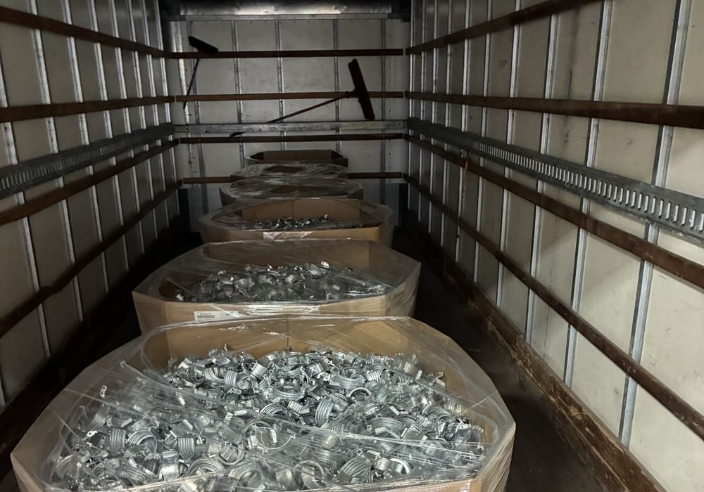 Gaylords of metal parts in a dry van