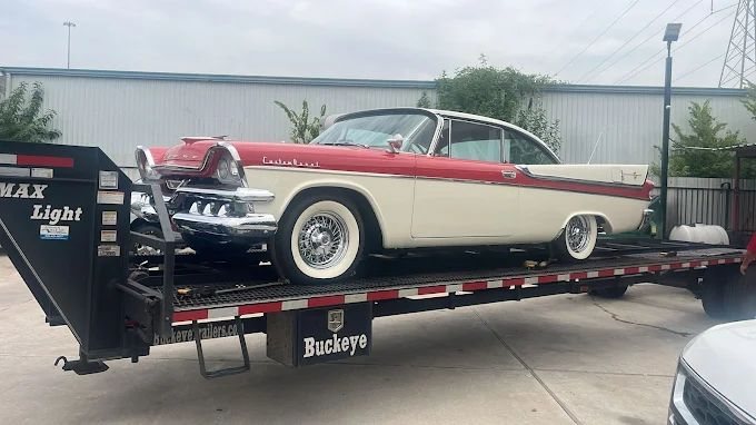 Classic car on a gooseneck car trailer